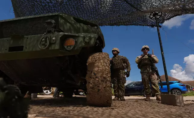 U.S. Army personnel keep watch over the U.S.-Mexico border in Roma, Texas, Thursday, Oct. 8, 2026. (AP Photo/Eric Gay)