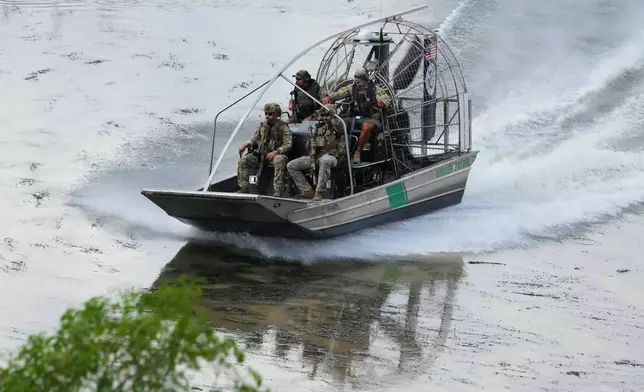 A U.S. Border Patrol airboat carries army personnel along the Rio Grande as they keep watch along the U.S.-Mexico border in Roma, Texas, Thursday, Oct. 8, 2026. (AP Photo/Eric Gay)