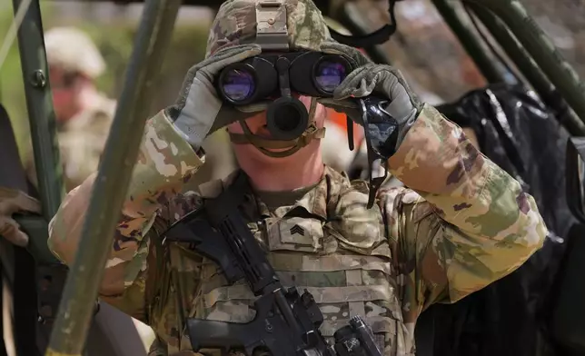 U.S. Army personnel keep watch over the U.S.-Mexico border in Roma, Texas, Thursday, Oct. 8, 2026. (AP Photo/Eric Gay)