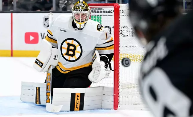 Boston Bruins goaltender Jeremy Swayman (1) makes a save against the Los Angeles Kings during the second period of an NHL hockey game Saturday, Oct. 17, 2026, in Los Angeles. (AP Photo/Wally Skalij)