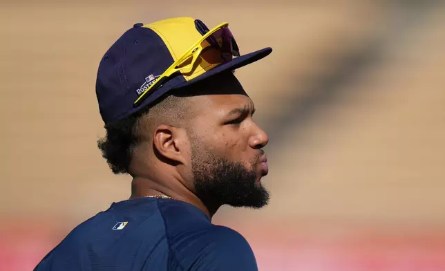 Milwaukee Brewers' Jackson Chourio walks across the field during a workout ahead of Game 3 of baseball's National League Championship Series against the Los Angeles Dodgers, Tuesday, Oct. 13, 2026, in Los Angeles. (AP Photo/Jae C. Hong)