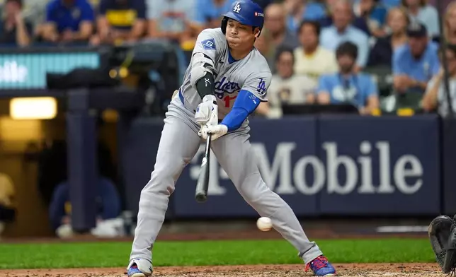 Los Angeles Dodgers designated hitter Shohei Ohtani strikes out during the sixth inning of Game 2 of baseball's National League Championship Series between the Milwaukee Brewers and the Los Angeles Dodgers, Monday, Oct. 12, 2026, in Milwaukee. (AP Photo/Abbie Parr)