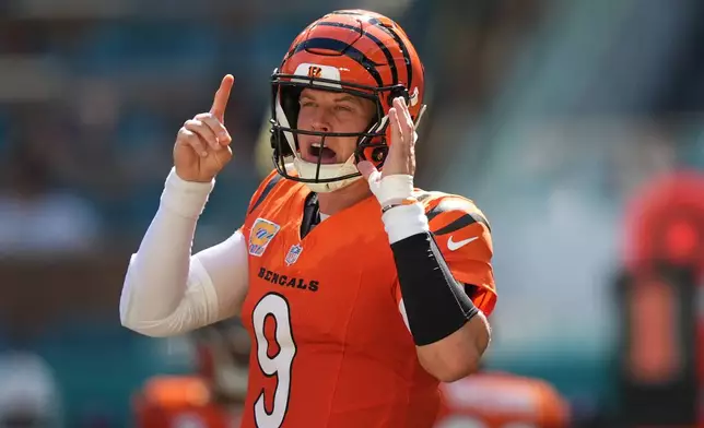 Cincinnati Bengals quarterback Joe Burrow (9) calls a play during the second half of an NFL football game against the Miami Dolphins in Miami Gardens, Fla., Sunday, Oct. 11, 2026. (AP Photo/Rebecca Blackwell)