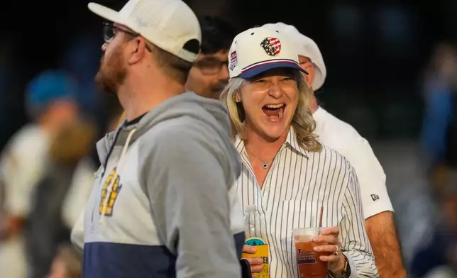 Milwaukee Brewers fans watch batting practice prior to Game 2 of baseball's World Series, Saturday, Oct. 24, 2026, in Milwaukee, between the Milwaukee Brewers and the Tampa Bay Rays. (AP Photo/Ashley Landis)