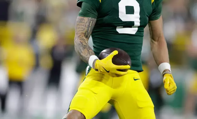Green Bay Packers wide receiver Christian Watson reacts after catching a pass for a first down during the first half of an NFL football game against the Carolina Panthers in Green Bay, Wis., Thursday, Oct. 29, 2026. (AP Photo/Matt Ludtke)