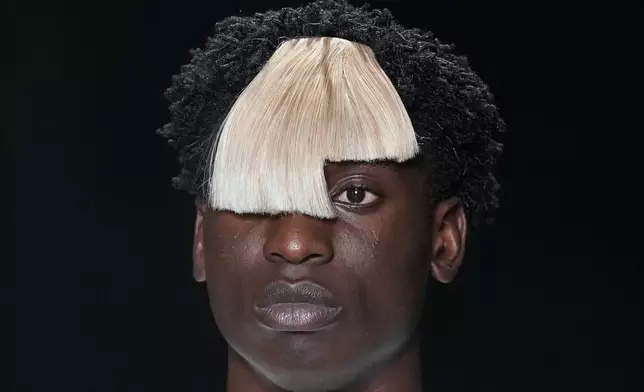 A model wears a creation from Joao Pimenta collection during the Sao Paulo Fashion Week in Sao Paulo, Thursday, Oct. 15, 2026. (AP Photo/Andre Penner)