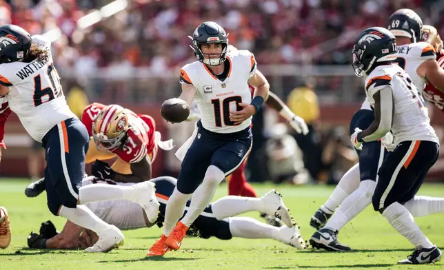 Denver Broncos quarterback Bo Nix (10) looks to pass the ball during the first half of an NFL football game against the San Francisco 49ers in Santa Clara, Calif., Sunday, Oct. 4, 2026. (Stephen Lam/San Francisco Chronicle via AP)