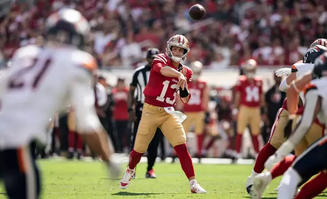San Francisco 49ers quarterback Brock Purdy (13) throws a pass during the first half of an NFL football game against the Denver Broncos in Santa Clara, Calif., Sunday, Oct. 4, 2026. (Stephen Lam/San Francisco Chronicle via AP)
