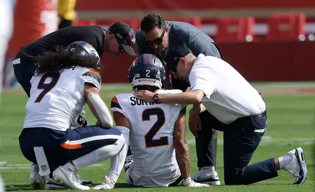 Denver Broncos cornerback Pat Surtain II (2) is tended to during the first half of an NFL football game against the San Francisco 49ers in Santa Clara, Calif., Sunday, Oct. 4, 2026. (AP Photo/Kelley L. Cox)