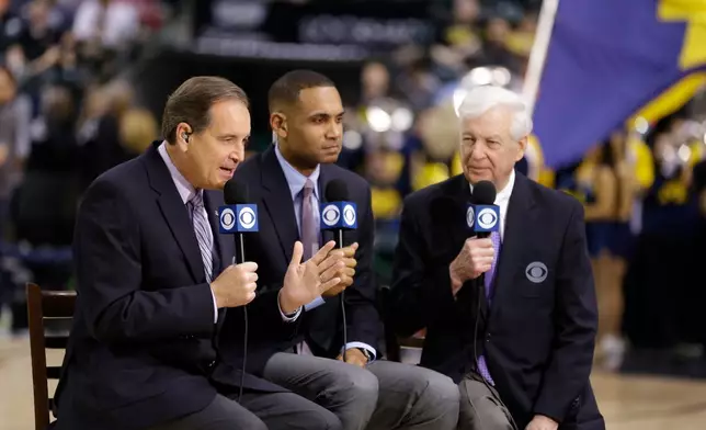 FILE - CBS broadcasters Jim Nantz, Grant Hill and Bill Raftery give commentary before an NCAA college basketball game during the semifinals of the Big Ten Conference tournament in Indianapolis, March 12, 2016. (AP Photo/Michael Conroy, File)