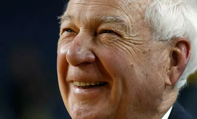 FILE - Bill Raftery, a CBS college basketball analyst, smiles after an NCAA basketball game between Michigan and Indiana in Ann Arbor, Mich., Dec. 11, 2017. (AP Photo/Paul Sancya, File)