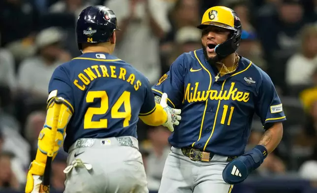 Milwaukee Brewers' Jackson Chourio (11) celebrates after scores on a hit by Christian Yelich during the third inning of Game 3 of baseball's World Series, Monday, Oct. 26, 2026, in St. Petersburg, Fla., between the Milwaukee Brewers and the Tampa Bay Rays. (AP Photo/Ashley Landis)