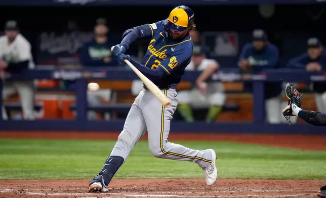 Milwaukee Brewers second baseman Brice Turang connects for a two-RBI base hit during the fifth inning of Game 3 of baseball's World Series, Monday, Oct. 26, 2026, in St. Petersburg, Fla., between the Milwaukee Brewers and the Tampa Bay Rays. (AP Photo/Chris O'Meara)
