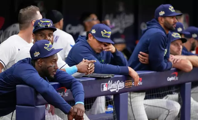 Members of the Tampa Bay Rays watch during the seventh inning of Game 3 of baseball's World Series, Monday, Oct. 26, 2026, in St. Petersburg, Fla., between the Milwaukee Brewers and the Tampa Bay Rays. (AP Photo/Ashley Landis)