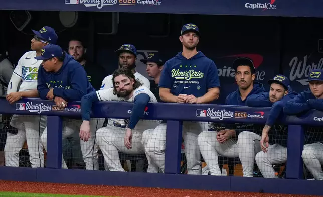 Tampa Bay Rays players watch from the dugout during the fifth inning of Game 3 of baseball's World Series, Monday, Oct. 26, 2026, in St. Petersburg, Fla., between the Milwaukee Brewers and the Tampa Bay Rays. (AP Photo/Chris O'Meara)