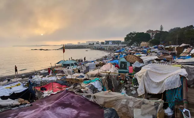 Makeshift tents used as a temporary camp settled by migrants on El Trampolín Beach in the Spanish enclave of Ceuta, Friday, Oct. 2, 2026. (AP Photo/Bernat Armangue)