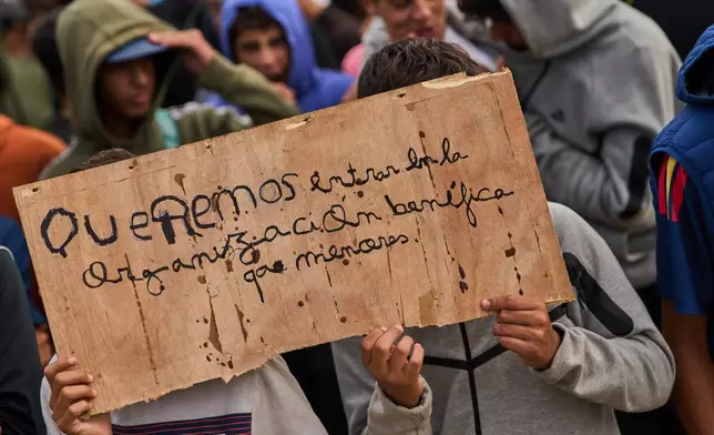 Moroccan minors gather on El Trampolín Beach during a protest demanding access to government-run centers for minors in the Spanish enclave of Ceuta, Wednesday, Sept. 30, 2026. (AP Photo/Bernat Armangue)
