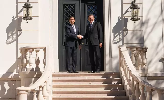 U.S. Secretary of State Marco Rubio is greeted by Portugal's Prime Minister Luis Montenegro, Thursday, Oct. 8, 2026, at the Sao Bento Palace in Lisbon. (AP Photo/Mark Schiefelbein, Pool)