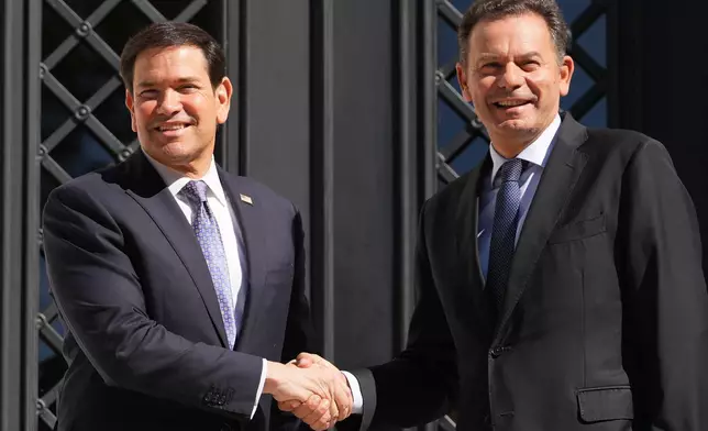 U.S. Secretary of State Marco Rubio is greeted by Portugal's Prime Minister Luis Montenegro, Thursday, Oct. 8, 2026, at the Sao Bento Palace in Lisbon. (AP Photo/Mark Schiefelbein, Pool)