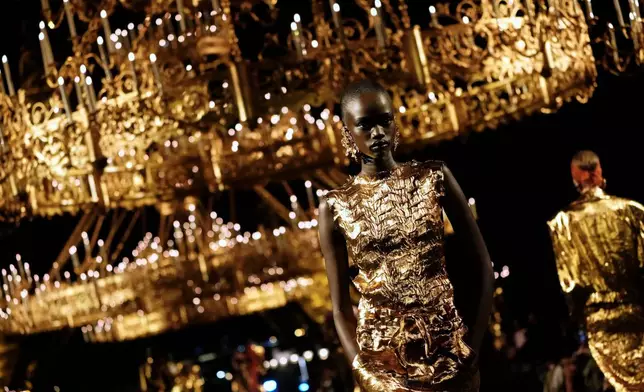 A model wears a creation as part of the Saint Laurent Womenswear Spring Summer 2027 collection presented in Paris, France, Tuesday, Sept. 29, 2026. (AP Photo/Teresa Suarez)