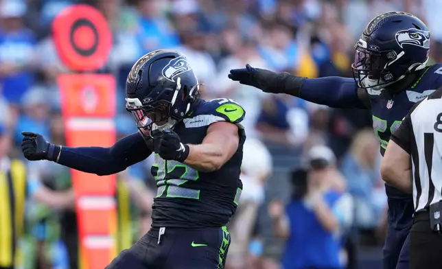 Seattle Seahawks linebacker Drake Thomas celebrates after a tackle during the second half of an NFL football game against the Los Angeles Chargers, Sunday, Oct. 4, 2026, in Seattle. (AP Photo/Lindsey Wasson)