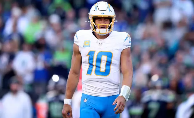 Los Angeles Chargers quarterback Justin Herbert reacts during the second half of an NFL football game against the Seattle Seahawks, Sunday, Oct. 4, 2026, in Seattle. (AP Photo/Kevin Ng)