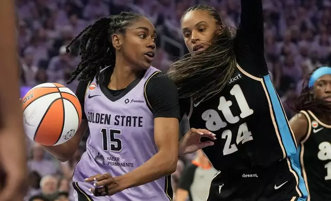 Golden State Valkyries guard Tiffany Hayes (15) drives to the basket against Atlanta Dream guard DeWanna Bonner (24) during the first half of Game 5 of the WNBA basketball finals, Monday, Oct. 26, 2026, in San Francisco. (AP Photo/Jeff Chiu)