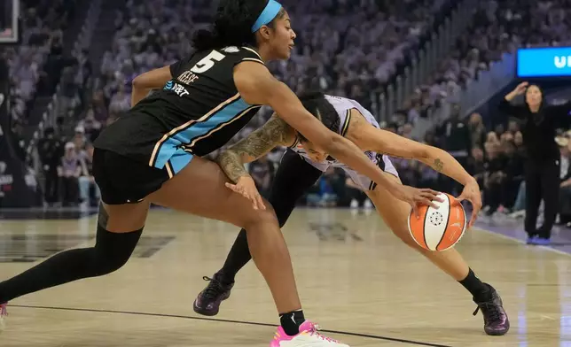 Atlanta Dream forward Angel Reese (5) reaches for the ball next to Golden State Valkyries forward Gabby Williams during the first half of Game 5 of the WNBA basketball finals, Monday, Oct. 26, 2026, in San Francisco. (AP Photo/Jeff Chiu)