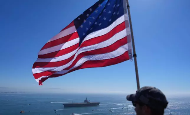 The USS Abraham Lincoln aircraft carrier returns to the San Diego Bay after deployment Thursday, Oct. 8, 2026, in San Diego. (AP Photo/Jae C. Hong)
