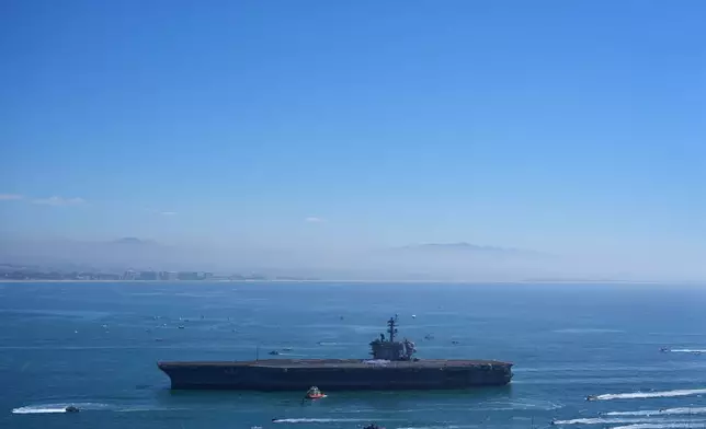 The USS Abraham Lincoln aircraft carrier returns to the San Diego Bay after deployment Thursday, Oct. 8, 2026, in San Diego. (AP Photo/Jae C. Hong)