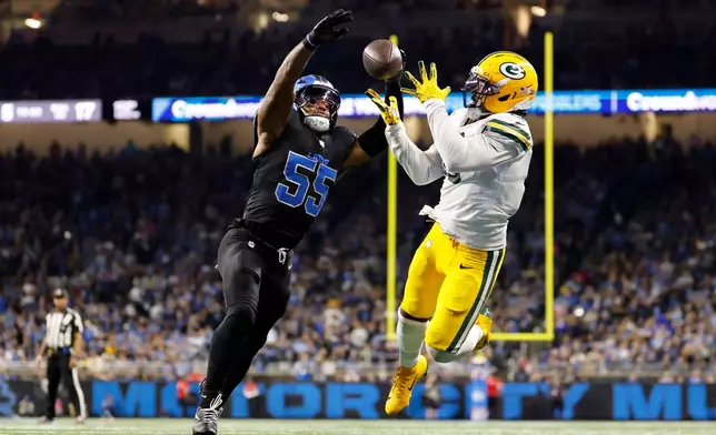 Detroit Lions linebacker Derrick Barnes (55) breaks up a pass intended for Green Bay Packers running back Josh Jacobs during the second half of an NFL football game, Sunday, Oct. 25, 2026, in Detroit. (AP Photo/Rey Del Rio)