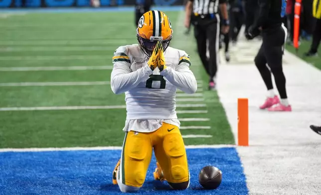 Green Bay Packers running back Josh Jacobs (8) celebrates after a touchdown reception during the second half of an NFL football game against the Detroit Lions, Sunday, Oct. 25, 2026, in Detroit. (AP Photo/Paul Sancya)