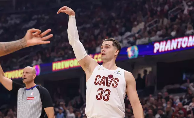 Cleveland Cavaliers forward Mario Hezonja (33) shoots in the first half of an NBA basketball game against the Brooklyn Nets in Cleveland, Saturday, Oct. 24, 2026. (AP Photo/Tim Phillis)