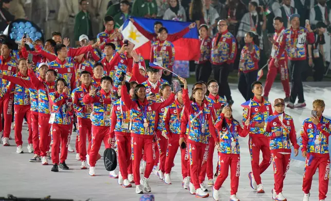 Athletes from the Philippines march into the arena during the closing ceremony for the Asian Games in Nagoya, Japan, Sunday, Oct. 4, 2026. (AP Photo/Eugene Hoshiko)