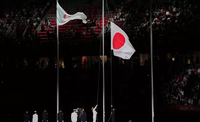 The Japanese flag is hoisted during the closing ceremony of the Asian Games in Nagoya, Japan, Sunday, Oct. 4, 2026. (AP Photo/Dita Alangkara)