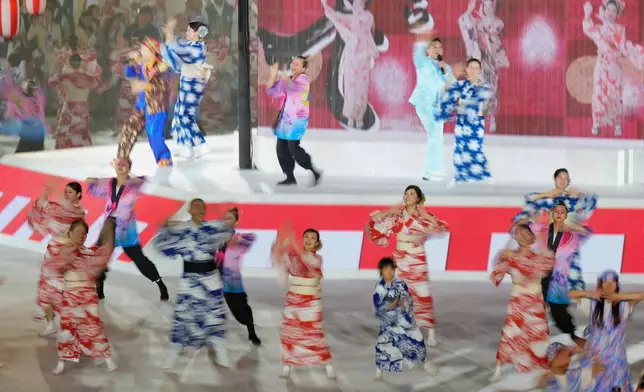 Dancers perform during the closing ceremony for the Asian Games in Nagoya, Japan, Sunday, Oct. 4, 2026. (AP Photo/Eugene Hoshiko)