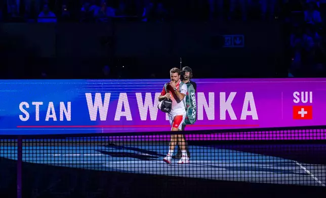 Switzerland's Stan Wawrinka walks onto the court for his first round match against Czech Republic's Jiri Lehecka at the Swiss Indoors tennis tournament in Basel, Switzerland, Tuesday, Oct. 27, 2026. (Georgios Kefalas/Keystone via AP)