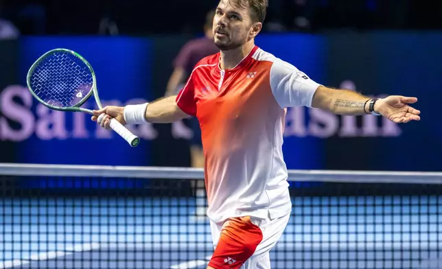 Switzerland's Stan Wawrinka reacts during a first round match against Czech Republic's Jiri Lehecka at the Swiss Indoors tennis tournament in Basel, Switzerland, Tuesday, Oct. 27, 2026. (Georgios Kefalas/Keystone via AP)
