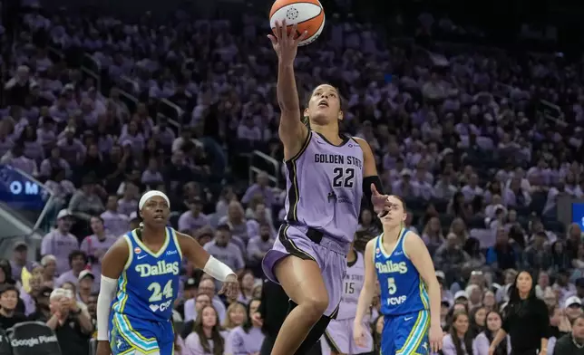 Golden State Valkyries guard Veronica Burton (22) shoots against Dallas Wings guard Arike Ogunbowale (24) and guard Paige Bueckers (5) during the second half of Game 3 of a WNBA basketball first-round playoff series, Friday, Oct. 2, 2026, in San Francisco. (AP Photo/Jeff Chiu)