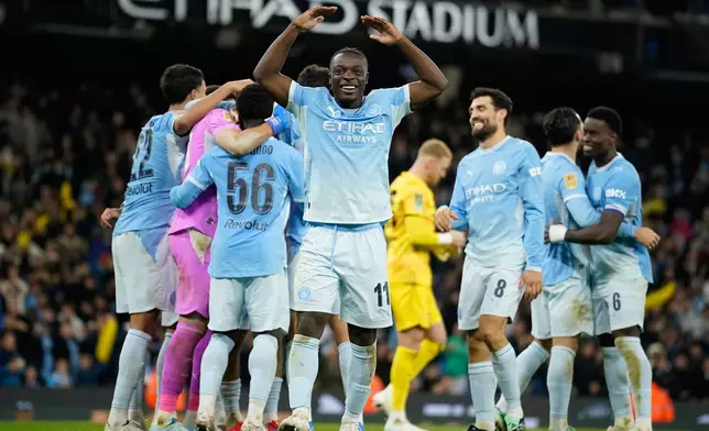 Manchester City players celebrate at the end of the English League Cup soccer match between Manchester City and Brighton and Hove Albion in Manchester, England, Wednesday, Oct. 28, 2026. (AP Photo/Dave Thompson)