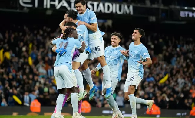 Manchester City players celebrate at the end of the English League Cup soccer match between Manchester City and Brighton and Hove Albion in Manchester, England, Wednesday, Oct. 28, 2026. (AP Photo/Dave Thompson)
