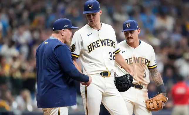 Milwaukee Brewers manager Pat Murphy, left, pulls pitcher Jacob Misiorowski from the game during the fifth inning of Game 1 of baseball's National League Championship Series between the Milwaukee Brewers and the Los Angeles Dodgers, Sunday, Oct. 11, 2026, in Milwaukee. (AP Photo/Ashley Landis)