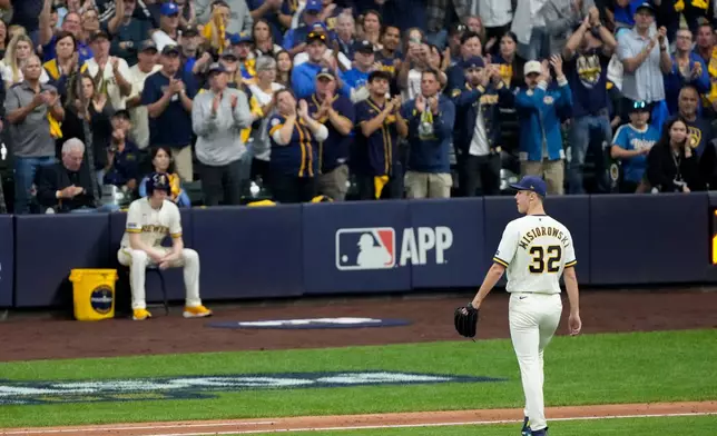 Milwaukee Brewers pitcher Jacob Misiorowski leaves the game during the fifth inning of Game 1 of baseball's National League Championship Series between the Milwaukee Brewers and the Los Angeles Dodgers, Sunday, Oct. 11, 2026, in Milwaukee. (AP Photo/Kyla Wolf)