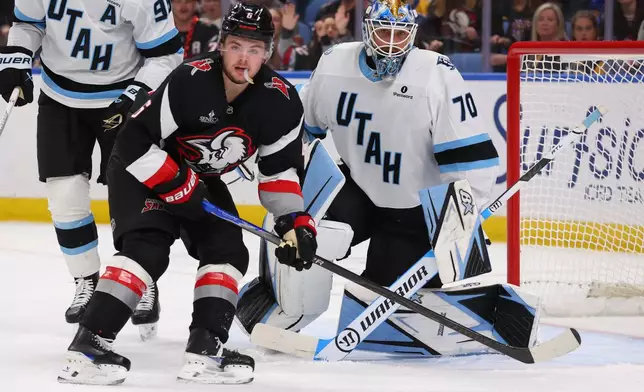 Buffalo Sabres left wing Zach Benson (6) skates in front of Utah Mammoth goaltender Karel Vejmelka (70) during the first period of an NHL hockey game Saturday, Oct. 10, 2026, in Buffalo, N.Y. (AP Photo/Jeffrey T. Barnes)
