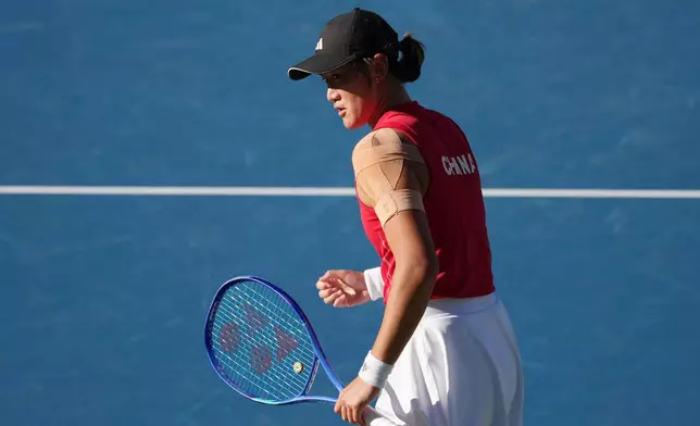 China's Wang Xiyu celebrates winning a point over China's Zhang Shuai during the Women's singles final tennis match at the Asian Games in Nagoya, Japan, Friday, Oct. 2, 2026. (AP Photo/Aaron Favila)