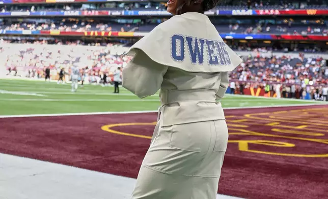 Simone Biles, multiple Olympic and World champion gymnast, and wife of Indianapolis Colts safety Jonathan Owens (38) stands on the side of the field before an NFL football game between Indianapolis Colts and Washington Commanders in London, Sunday, Oct. 4, 2026. (AP Photo/Ian Walton)