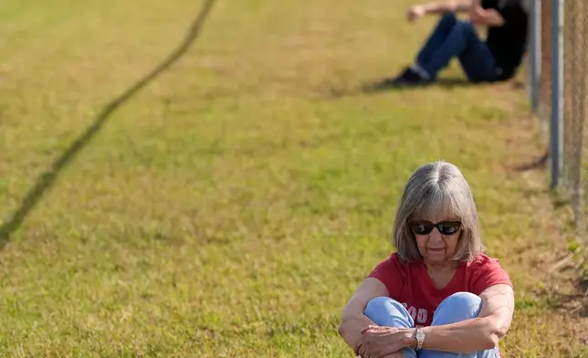 Beth Howard sits in the area reserved for people opposed to the death penalty outside Riverbend Maximum Security Institution before the planned execution of Christa Pike, Wednesday, Sept. 30, 2026, in Nashville, Tenn. (AP Photo/George Walker IV)