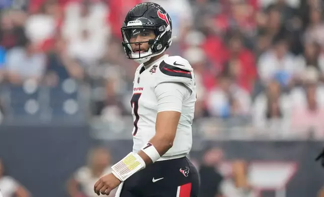 Houston Texans quarterback C.J. Stroud looks to the sideline during the first half of an NFL football game against the Dallas Cowboys in Houston, Sunday, Oct. 4, 2026. (AP Photo/Ashley Landis)