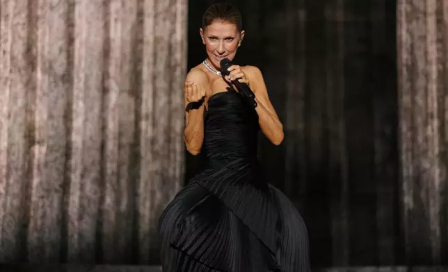 FILE - Singer Celine Dion performs during the opening concert of her "Celine Dion Paris 2026" residency at the Plenitude Arena in Nanterre, outside Paris, on Sept. 12, 2026. (AP Photo/Aurelien Morissard, File)