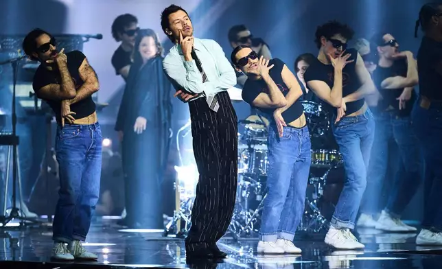 FILE - Harry Styles performs during the Brit Awards 2026 in Manchester, England, on Feb. 28, 2026. (Photo by Scott A Garfitt/Invision/AP, File)
